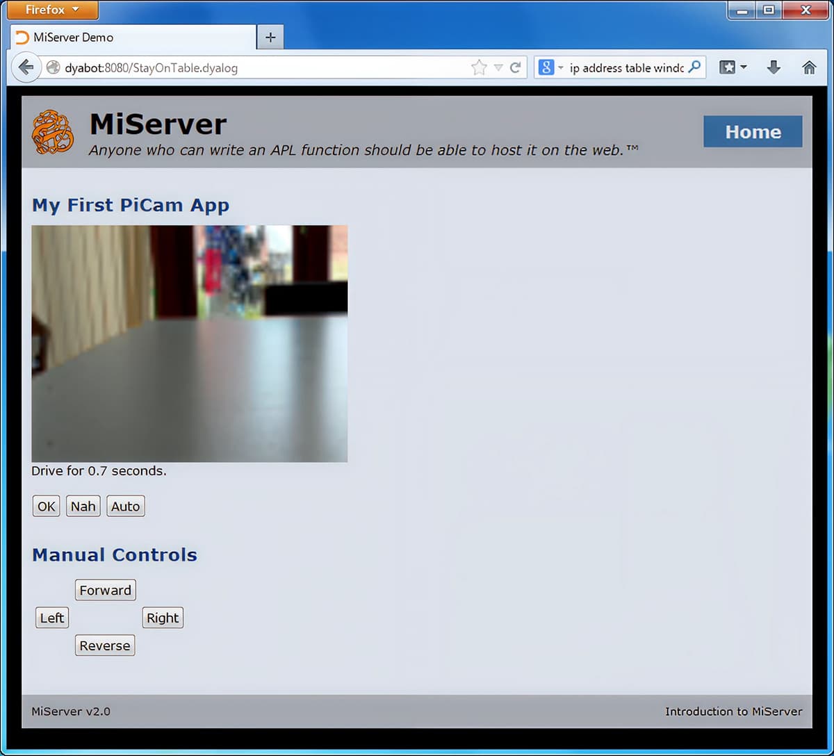 Screenshot of a MiServer web page titled ‘My First PiCam App’ showing a live PiCam view of a table edge and on-screen robot controls (OK, Nah, Auto, Forward, Left, Right, Reverse).