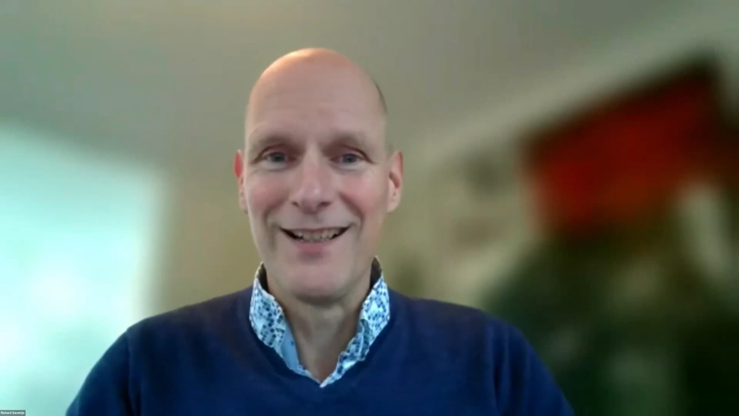 Richard Savenije presenting online during APL Seeds ’23, smiling against a softly blurred background.