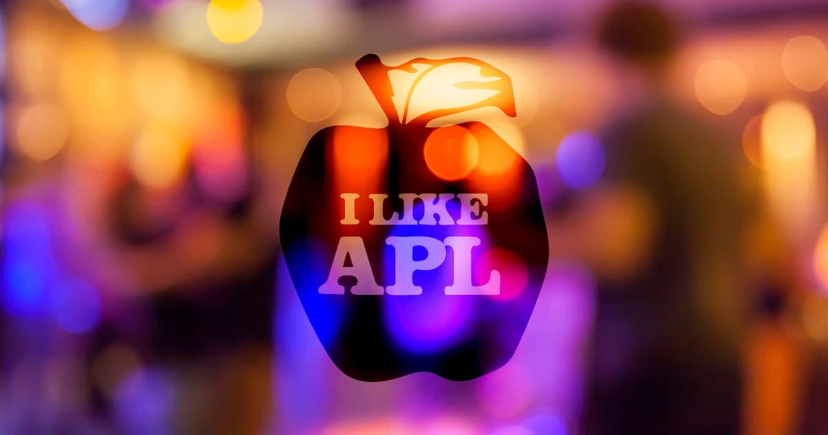 Colourful celebration bokeh with an apple-shaped overlay that reads ‘I LIKE APL’, marking the APL@50 anniversary.