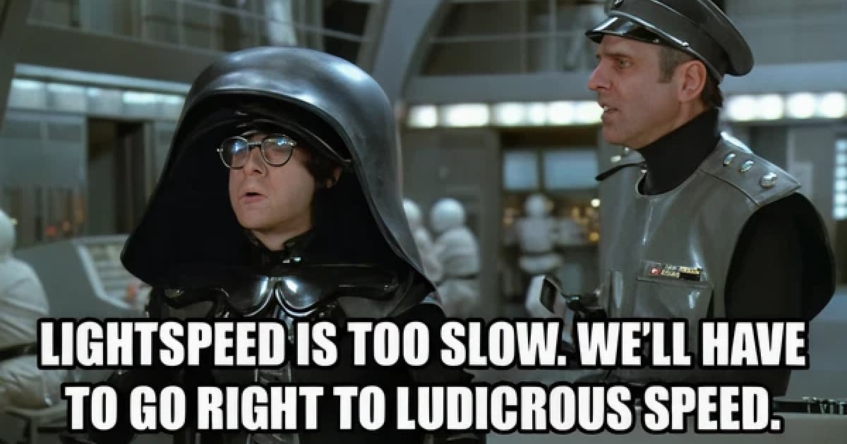 Scene from the film Spaceballs showing Dark Helmet and Colonel Sanders on a spaceship bridge. The caption text reads: “LIGHTSPEED IS TOO SLOW. WE’LL HAVE TO GO RIGHT TO LUDICROUS SPEED.
