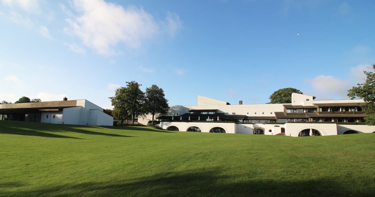 he Konventum Conference Centre in Helsingør, Denmark, bathed in morning sunshine. The modernist white building with arched windows and grassy slopes was the venue for Dyalog ’19.