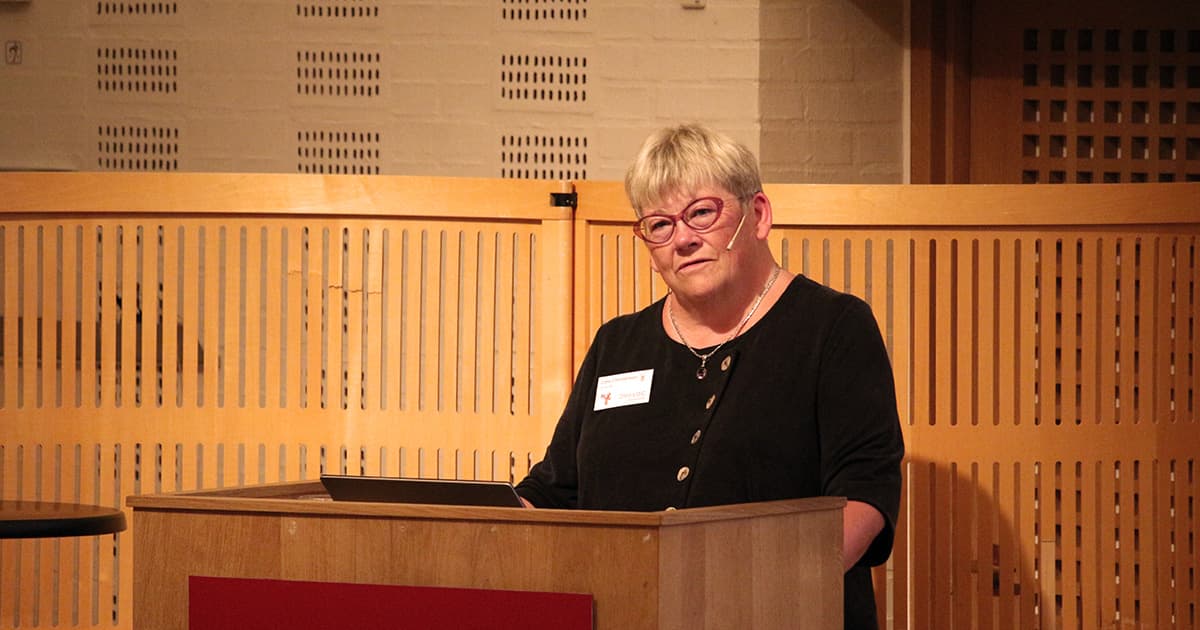 Gitte Christensen, CEO of Dyalog Ltd, speaking at the podium during the opening session of Dyalog ’19 in Elsinore, Denmark.